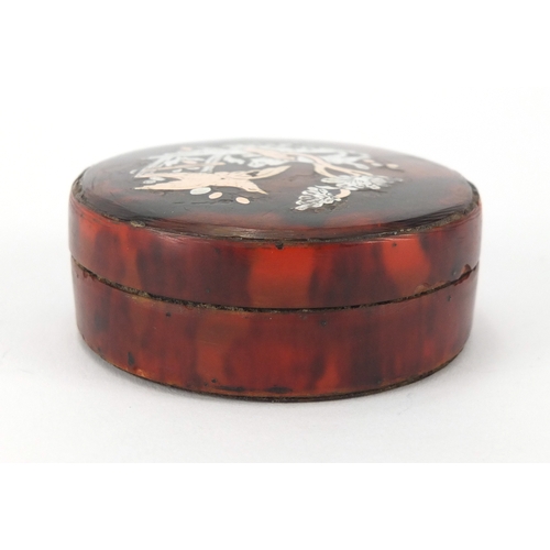 25 - 18th century circular red tortoiseshell snuff box with gold and silver pique work, decorated with a ... 