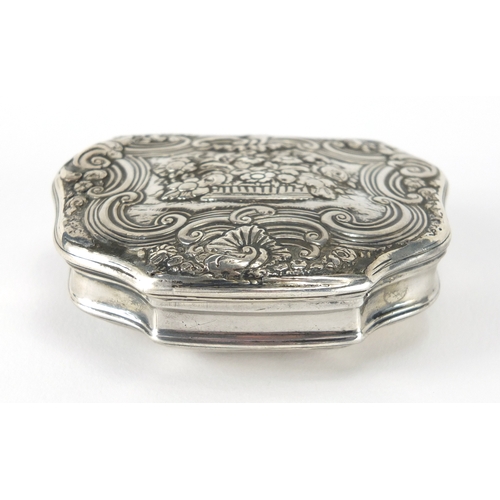 37 - 18th century continental unmarked silver snuff box with gilt interior, the hinged lid cast with flow... 