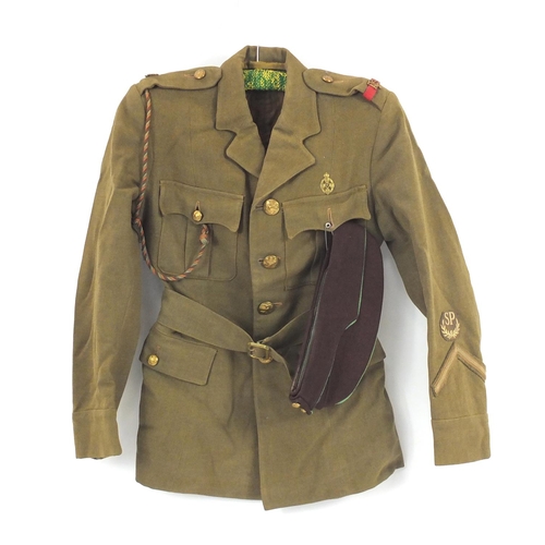 603 - Child's Military interest tunic and cap, with brass badges and buttons