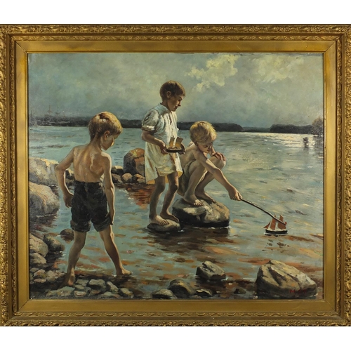2038 - Three young boys playing with model boats in water, St Ives school oil on canvas board, bearing a mo... 