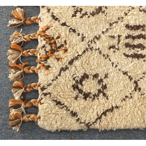 2027 - Rectangular Moroccan Berber rug, having a geometric design onto a predominantly cream ground, 296cm ... 