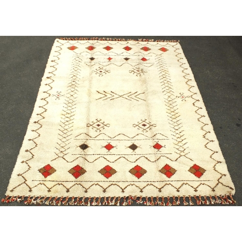 2010 - Rectangular Moroccan Berber carpet, having a geometric design onto a cream ground, 395cm x 305cm