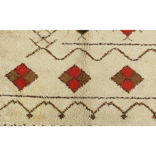 2010 - Rectangular Moroccan Berber carpet, having a geometric design onto a cream ground, 395cm x 305cm