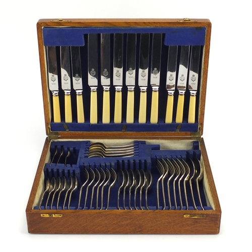 2043 - Oak six place canteen of Sheffield silver plated cutlery, 38cm wide