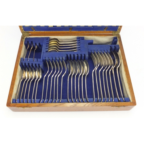 2043 - Oak six place canteen of Sheffield silver plated cutlery, 38cm wide