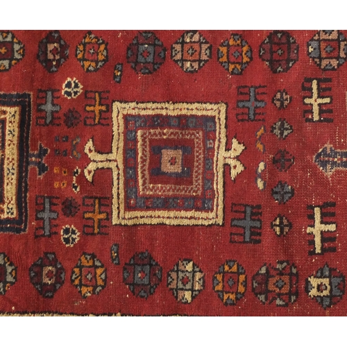 2052 - Rectangular Persian rug having and all over flower head and geometric design, 187cm x 96cm