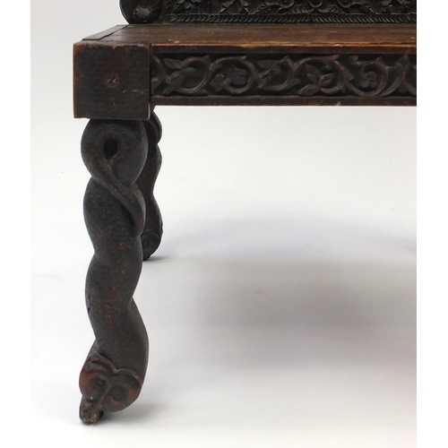 56A - Middle Eastern chair pierced and carved with two serpents and foliage, 93cm high