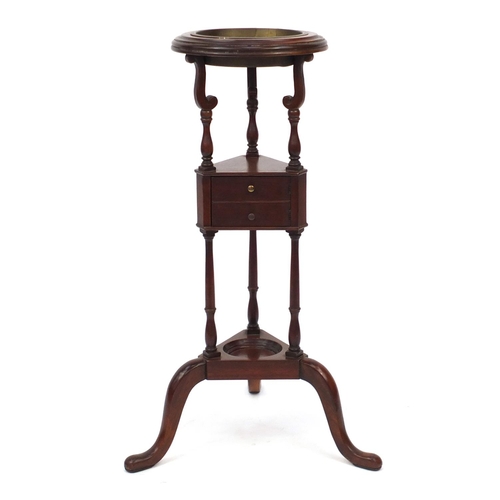 56 - Mahogany plant stand with turned column supports and tripod base, 81cm high