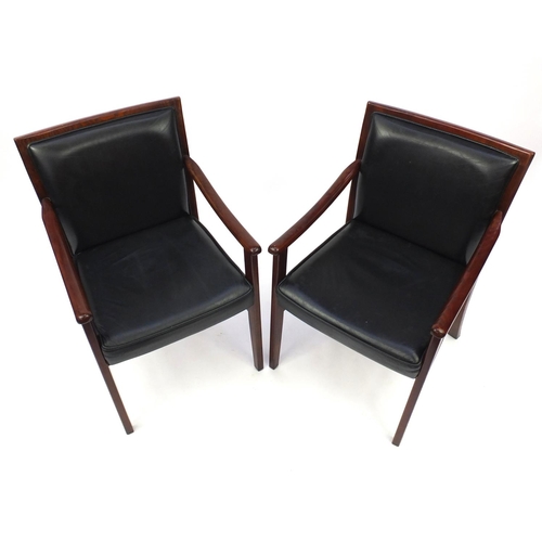 10 - Pair of Danish rosewood and black leather open armchairs, 86cm high