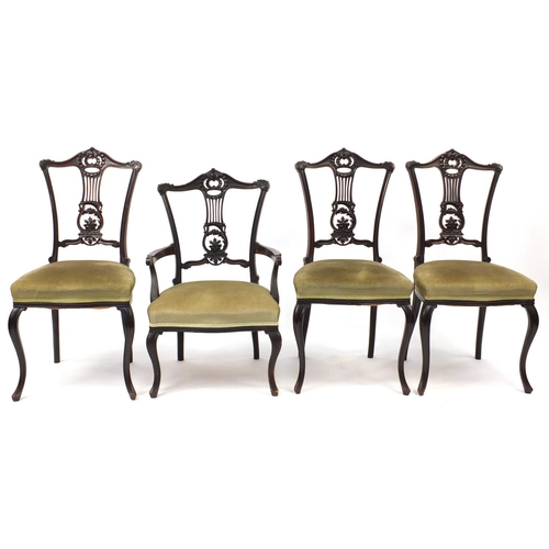 55 - Set of four mahogany chairs with lyre splats, including a carver