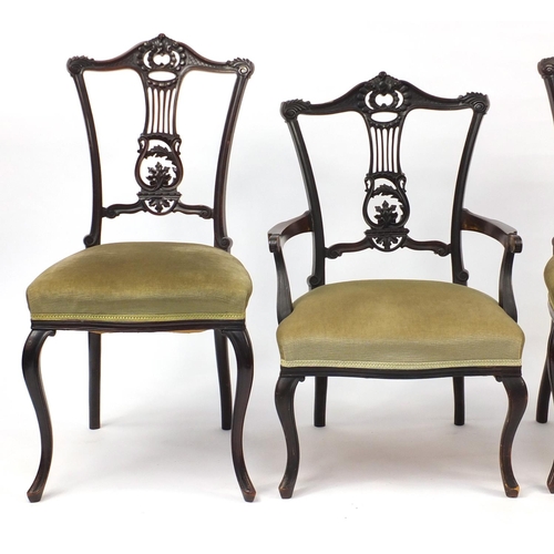 55 - Set of four mahogany chairs with lyre splats, including a carver