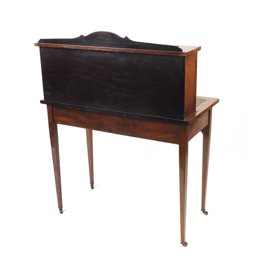 2006a - Edwardian rosewood bonheur du jour, with mirrored back and urn inlaid panelled doors, raised of tape... 