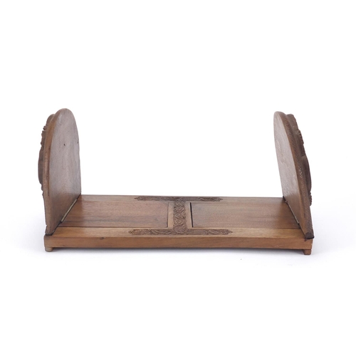 465 - Carved hardwood extending book slide, 30.5cm wide when closed