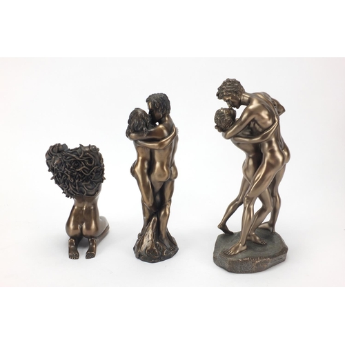 146 - Two bronzed erotic figure groups and one other, the largest 30cm high