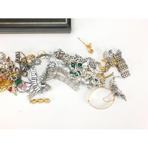 361 - Costume jewellery including animal brooches, necklaces and a gold plated bangle