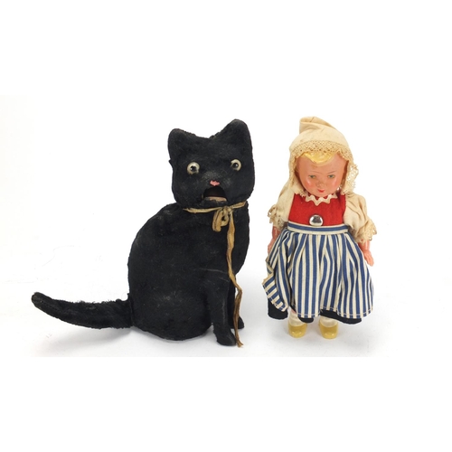 402 - Vintage clockwork toy cat and a composite Dutch girl doll, the cat 15cm high