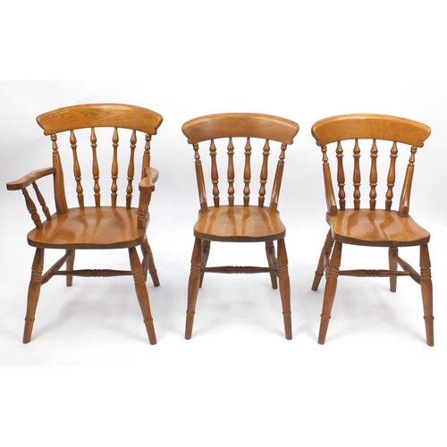 42 - Set of six pine effect spindle back dining chairs, to include to carvers