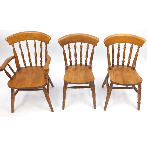 42 - Set of six pine effect spindle back dining chairs, to include to carvers