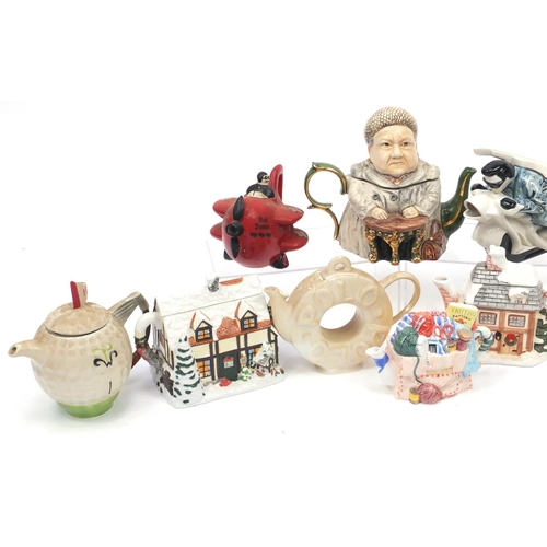 693 - Novelty teapots including a Carlton Ware red baron, Punch and cottages