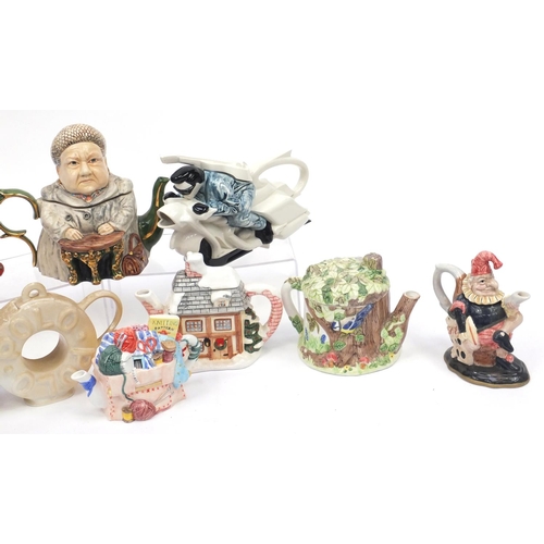 693 - Novelty teapots including a Carlton Ware red baron, Punch and cottages