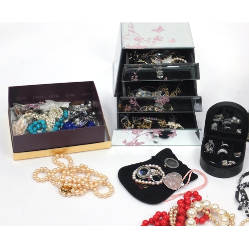 344 - Costume jewellery including earrings, necklaces, bracelets and brooches, housed in jewellery boxes