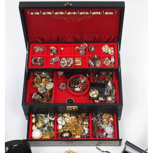 344 - Costume jewellery including earrings, necklaces, bracelets and brooches, housed in jewellery boxes