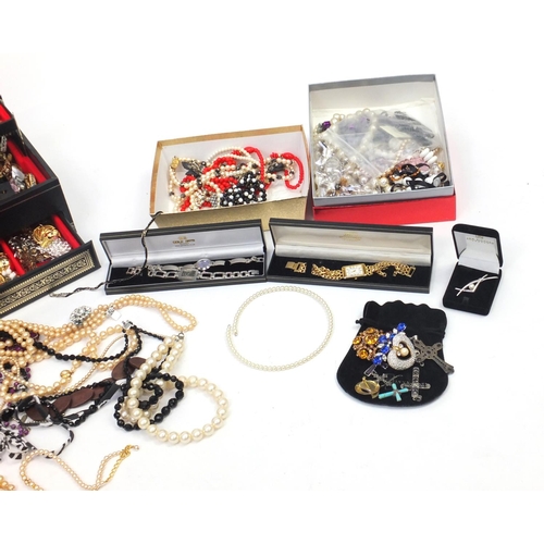 344 - Costume jewellery including earrings, necklaces, bracelets and brooches, housed in jewellery boxes