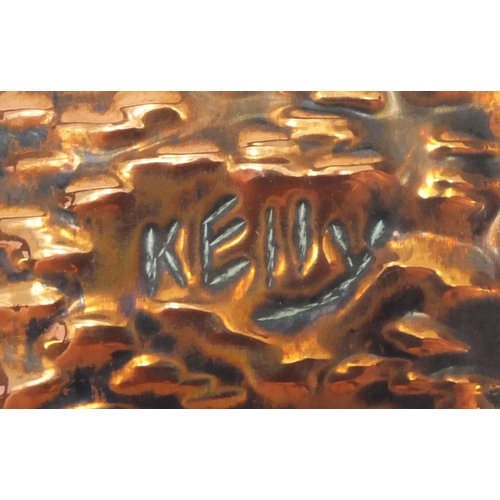 502 - Embossed copper panel of a Military figure with a drum, signed Kelly, 40cm x 20cm