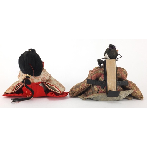 547 - Two Oriental bisque head dolls, the largest 13cm high