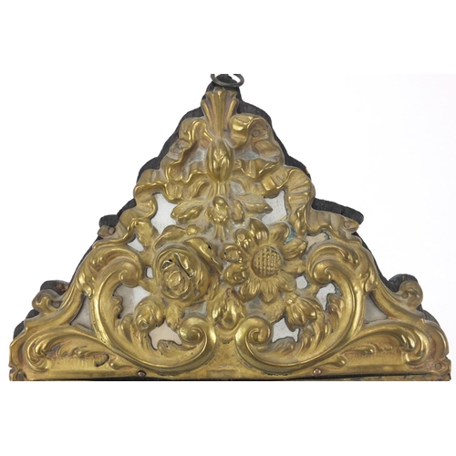 126 - Ornate embossed mirror with bevelled plate, 44cm x 23cm