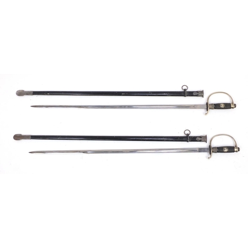 927 - Pair of German Military style SS design swords, with scabbards