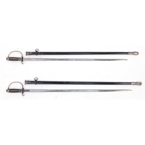 927 - Pair of German Military style SS design swords, with scabbards