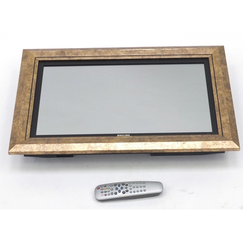 97 - Philips gilt framed 24inch mirror television, with remote