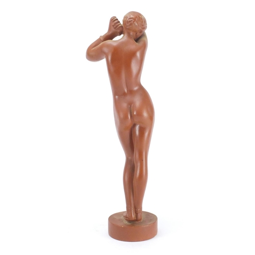 133 - Plaster figurine of a standing nude female, 42cm high