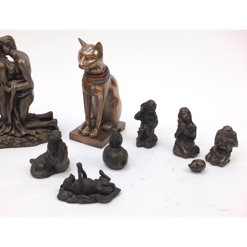 213 - Decorative bronze style figures including erotic couple, Egyptian cat and young children