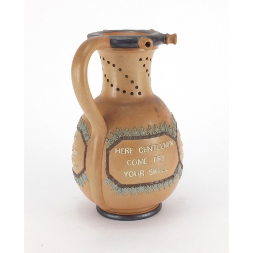 130 - Doulton Lambeth salt glazed stoneware puzzle jug, 22cm high