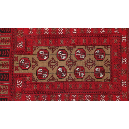 106 - Persian red ground prayer mat, with all over geometric design, 115cm x 80cm