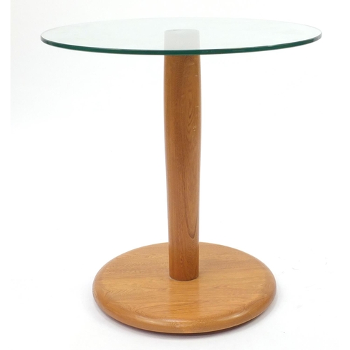 2014 - Ercol light elm occasional table with circular glass top, 62cm high x 60cm in diameter