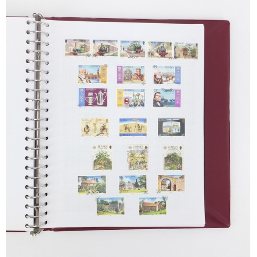 818 - Channel Island stamps arranged in an album