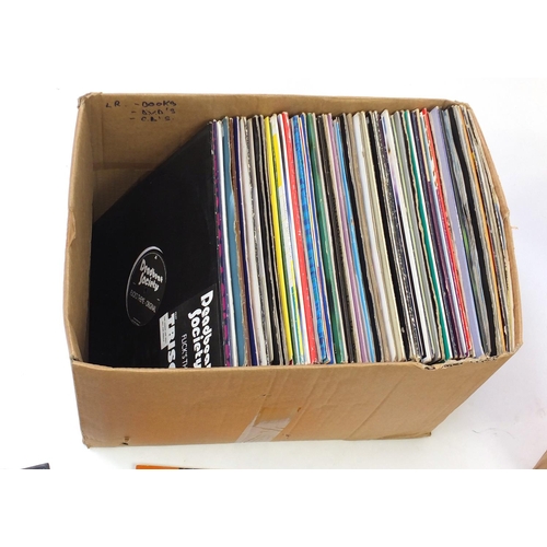 261 - Two boxes of vinyl LP's including Paula Abdul, promotional copy and Bad Boys