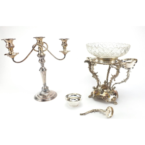 697 - Silver plated three branch candelabra and a silver plated centre epergne with cut glass bowl, 33cm h... 