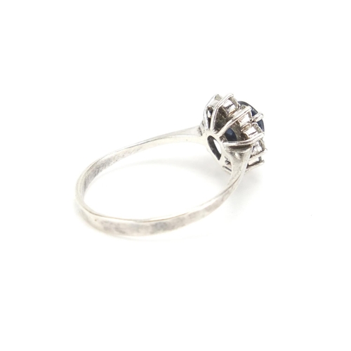 297 - Silver coloured metal blue and clear stone tear drop ring, size M, approximate weight 1.8g