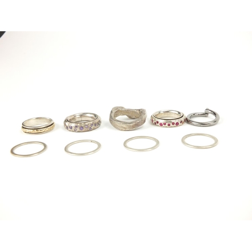 322 - Silver and white metal rings, some set with colourful stones, approximate weight 53.5g