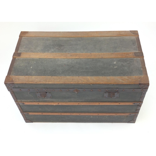 67 - Vintage metal and wooden bound travelling trunk, 55cm H x 90cm W x 50cm D