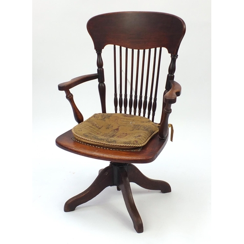 66 - Oak stick back captains chair, with leather seat