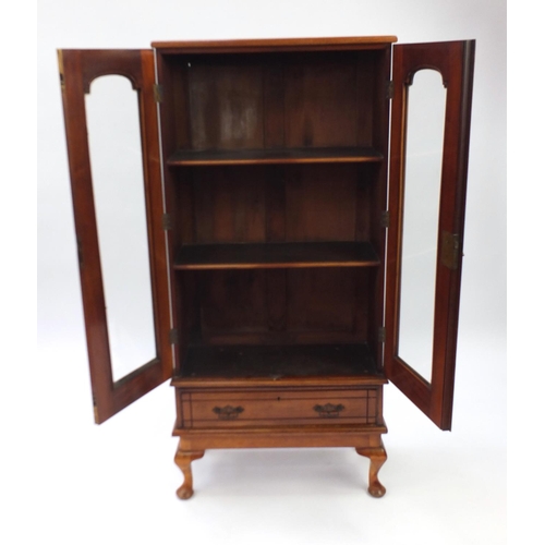 77 - Walnut bookcase on stand with base drawer, 147cm H x 68cm W x 28cm D