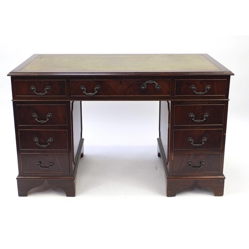 4 - Reproduction mahogany twin pedestal desk, fitted with nine drawers and tooled leather top, 77cm H x ... 
