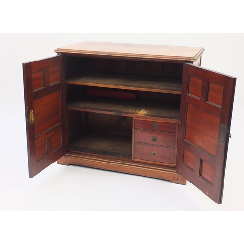 74 - Victorian walnut two door cupboard, with fielded panelled doors and three drawers to the interior, 7... 