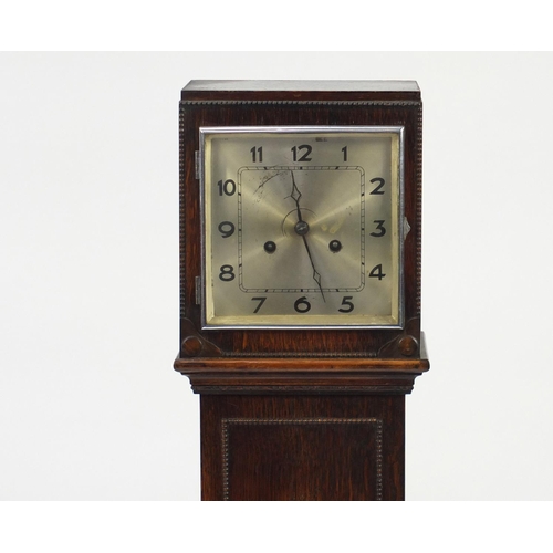 68 - Oak cased granddaughter clock, with silvered dial, 127cm high