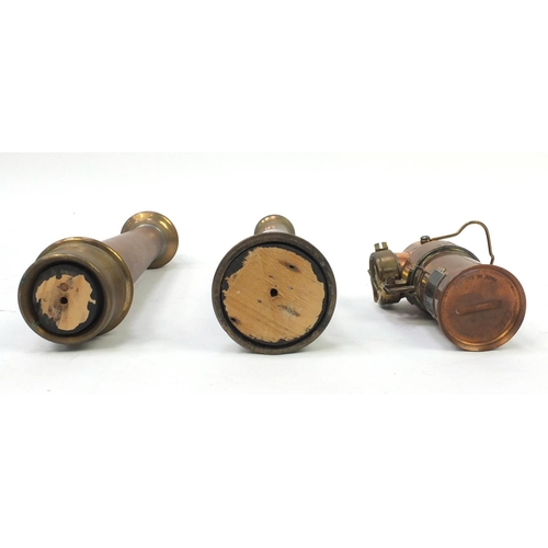 768 - Two fire hose nozzles and a Barnsley Yorks copper and brass lamp